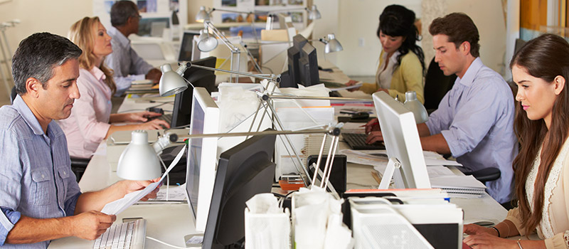 Office workers at desks in a modern workplace